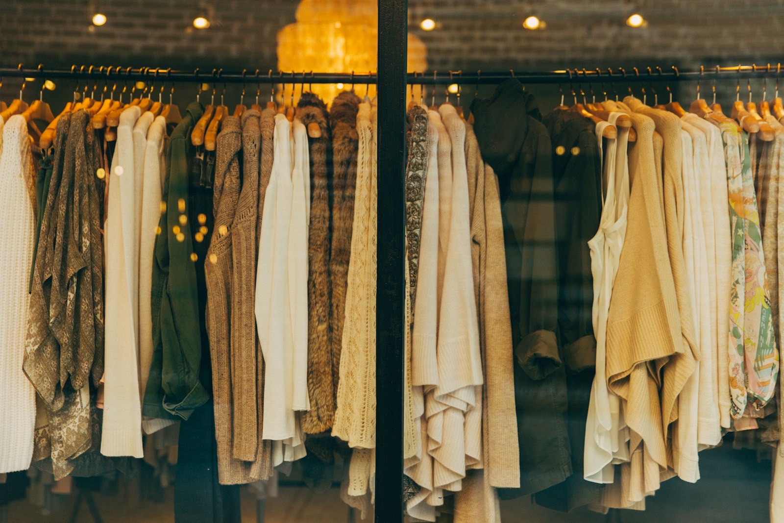 Garments hanging on a rail in a studio showroom