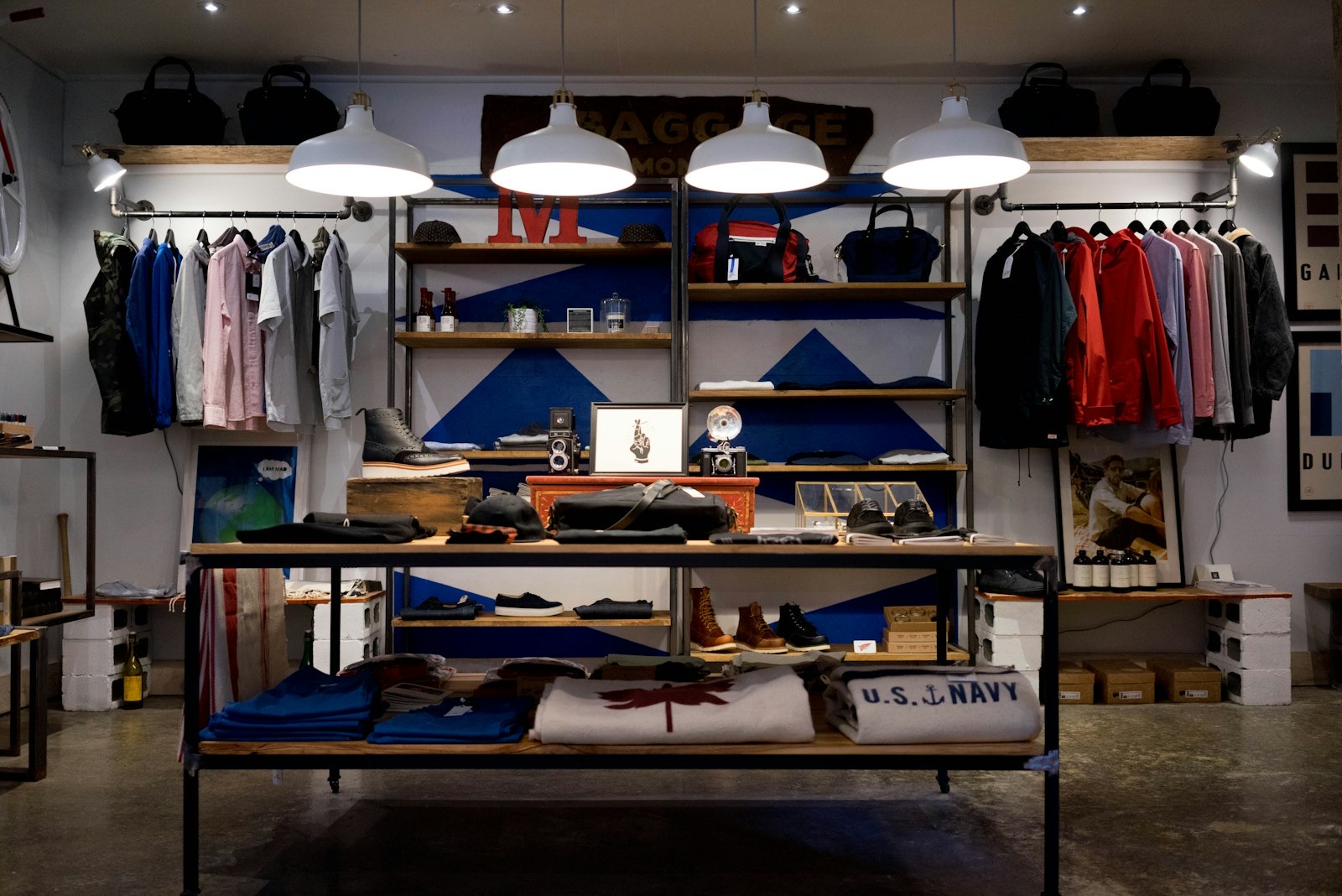 Clothing displayed on racks inside a bright retail-style space